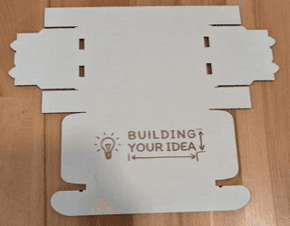 Laser-cut flat pattern for a custom low-volume mailer